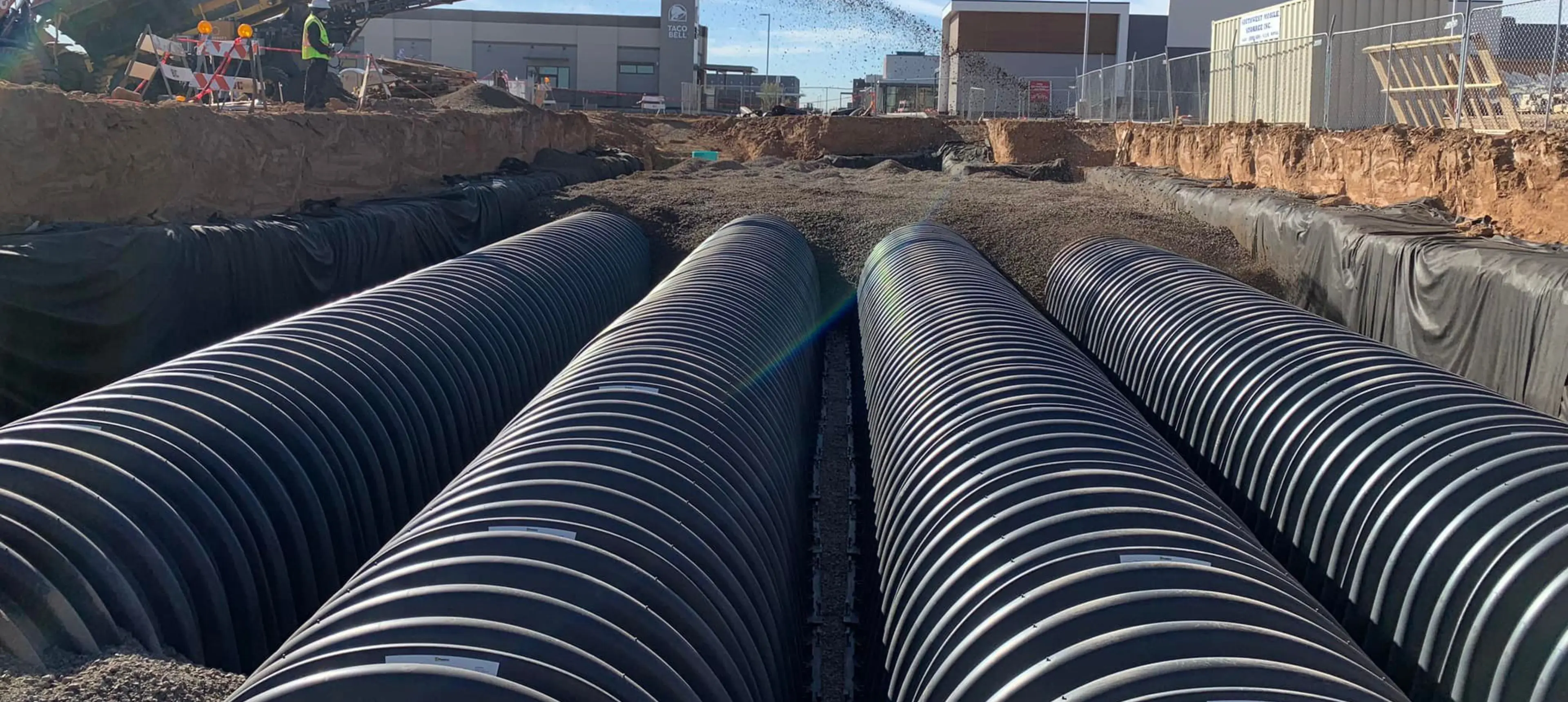 365534136_977557070326501_3686101694787260921_ (1) A bunch of pipes that are in the dirt.