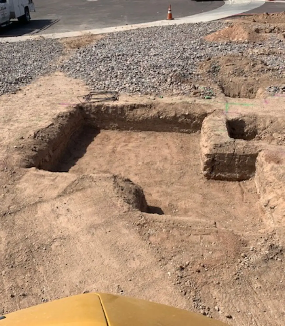 A large brick structure in the dirt.